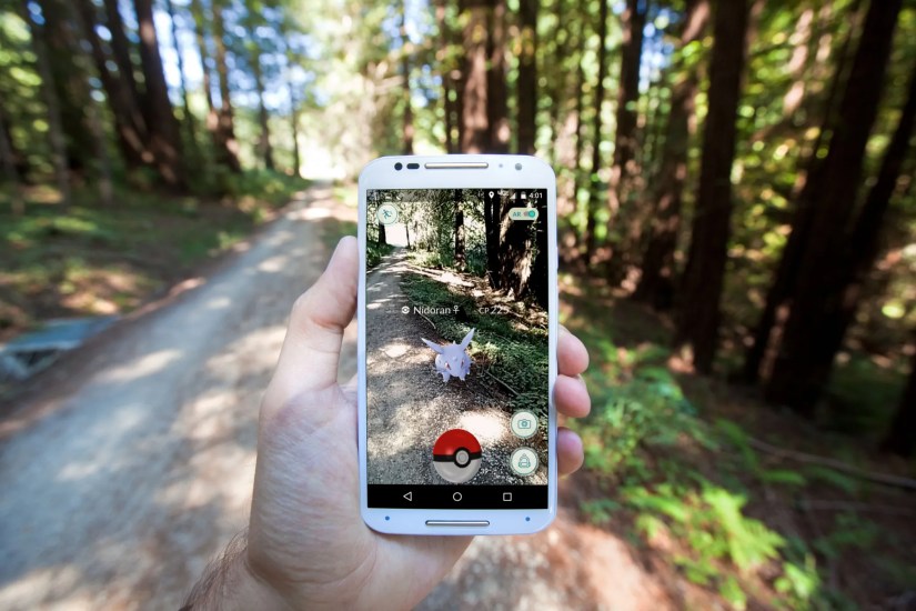 The hit augmented reality smartphone app &ldquo;Pokemon GO&rdquo; shows a Pokemon encounter overlain on a real world trail in the forest.