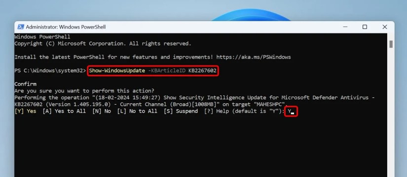 The command to unhide an update and &lsquo;Y&rsquo; typed in PowerShell.