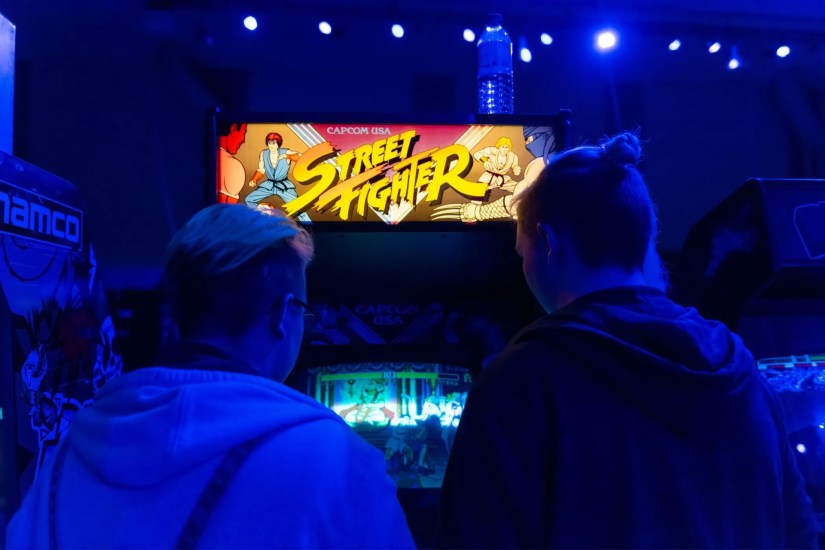 A vintage retro street fighter 2 arcade game signage on an old arcade game cabinet at a retro vintage arcade computer fair.