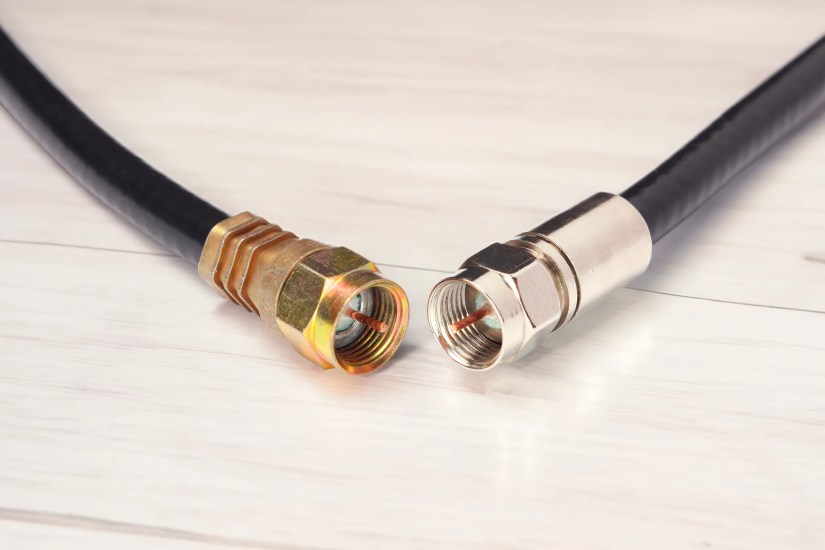 Two coaxial cables, a gold one on the left, and a silver one on the right.