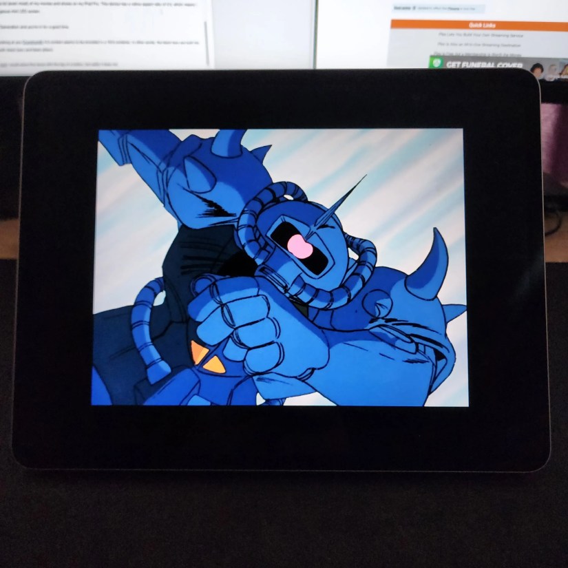 Gundam shown on an iPad with double black bars.