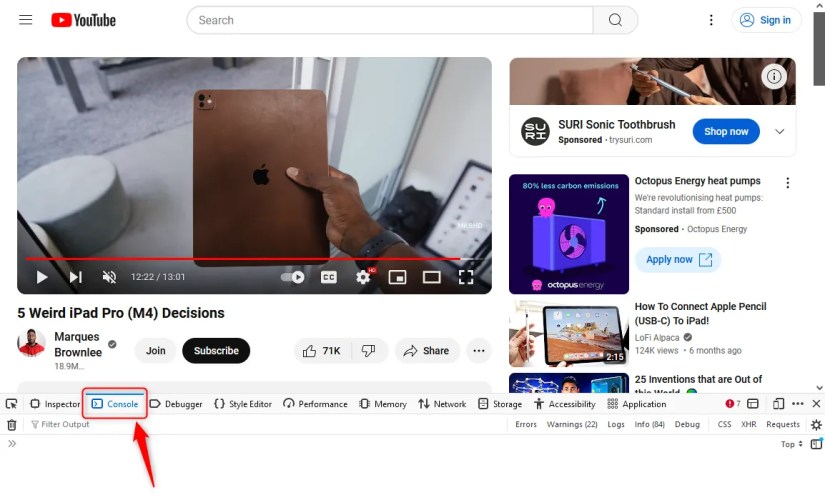 YouTube with the browser&rsquo;s developer tools open and an arrow showing the Console tab.