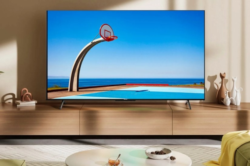 A Hisense U6N in a room on top of a TV stand.