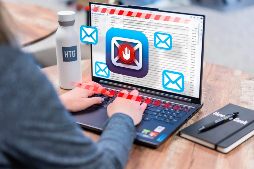 Woman using a laptop with some email icons popping out of the screen.