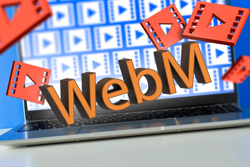 A laptop with several video file icons and a &lsquo;WebM&rsquo; above the keyboard and some 3D video icons around.