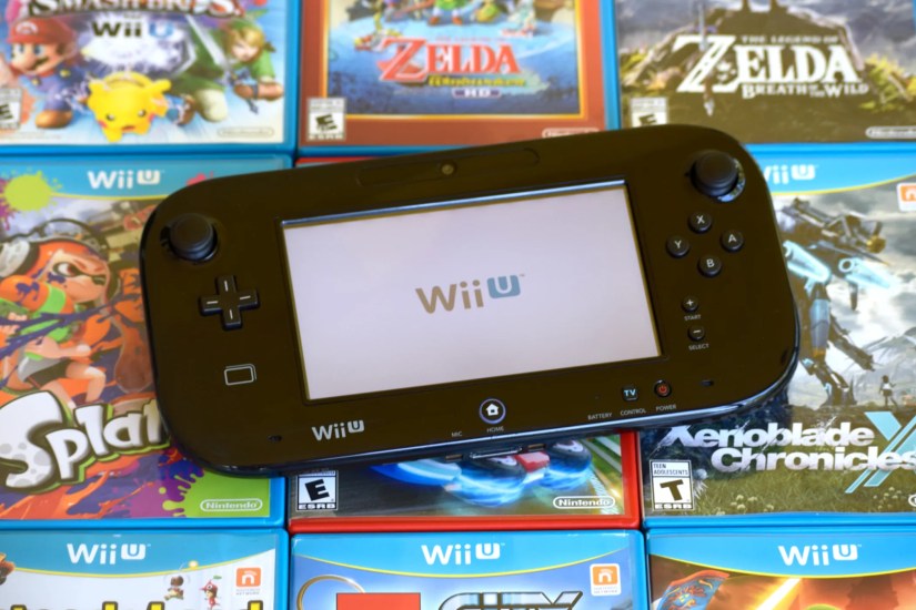 A Wii U GamePad on top of various Wii U exclusive games.
