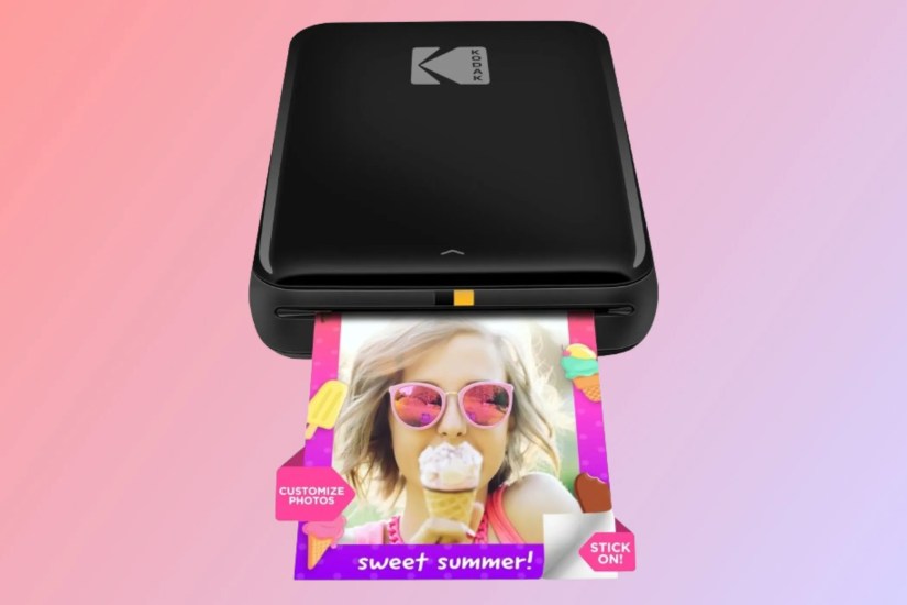 KODAK Step Instant Photo Printer on a gradient background