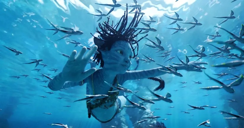 Scene from Avatar 2 of the characer Tuk swimming underwater.