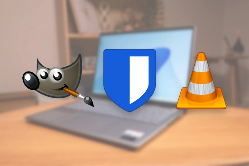 The GIMP, Bitwarden, and VLC app icons over a photo of a laptop.