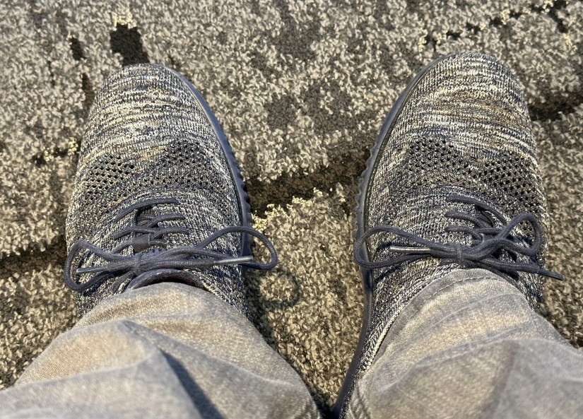 Shoes with a pattern blending in with the carpet pattern