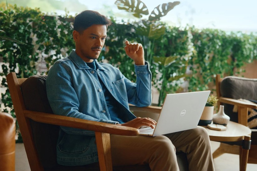 A Man Working on his Dell XPS Laptop