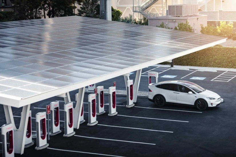 Mostly empty Tesla Supercharger Station with only one white car