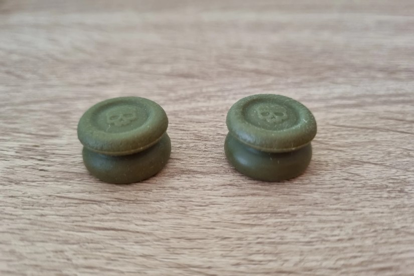 A pair of tall thumbstick covers.