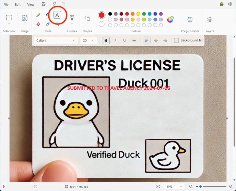 Adding a watermark in Microsoft paint.