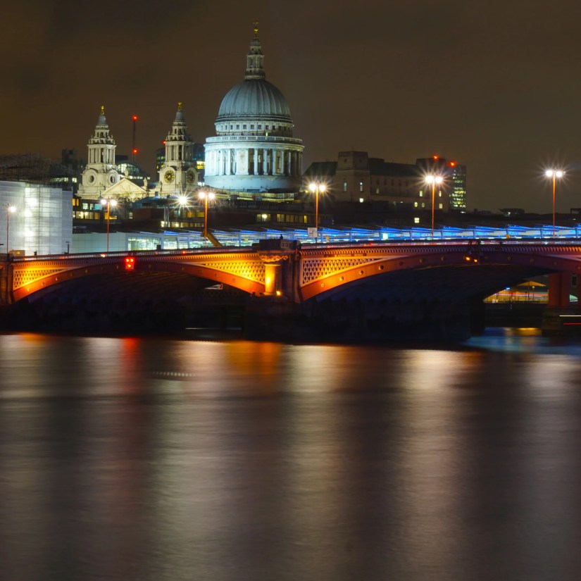 A night shot of St Paul&rsquo;s Cathedral in London, across the Thames.