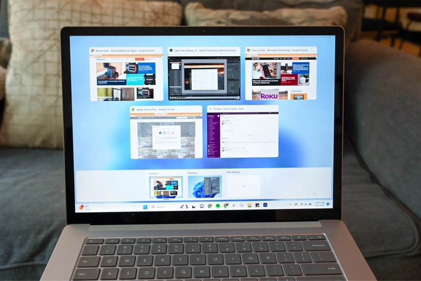 A clean Surface laptop placed on a couch.