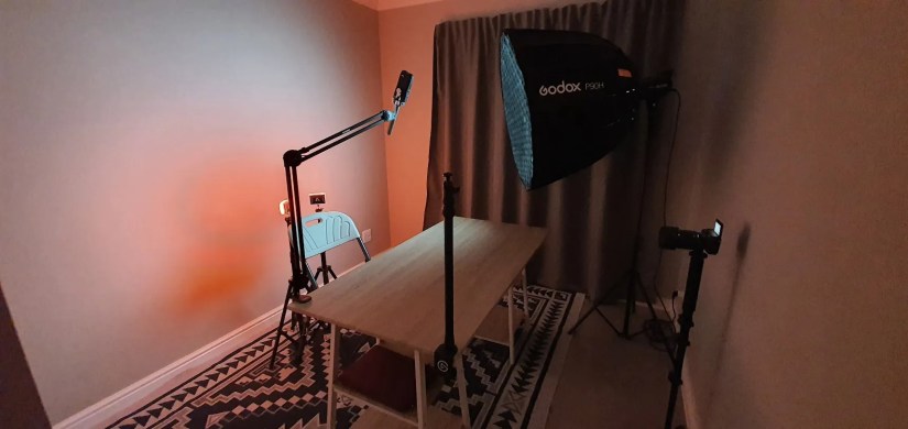 A YouTube studio setup using an off-screen shotgun mic.