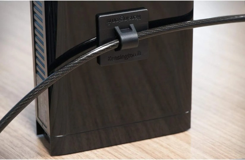 A Kensington desktop lock kit protecting a device.