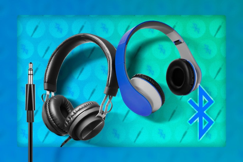A wired headphone next to a Bluetooth headphone.