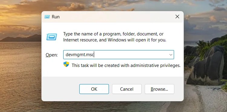 Opening Device Manager using Windows Run.