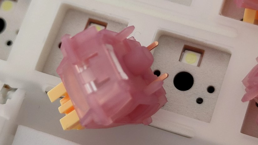 A close-up shot of the Outemu Silent Peach V3 switch.