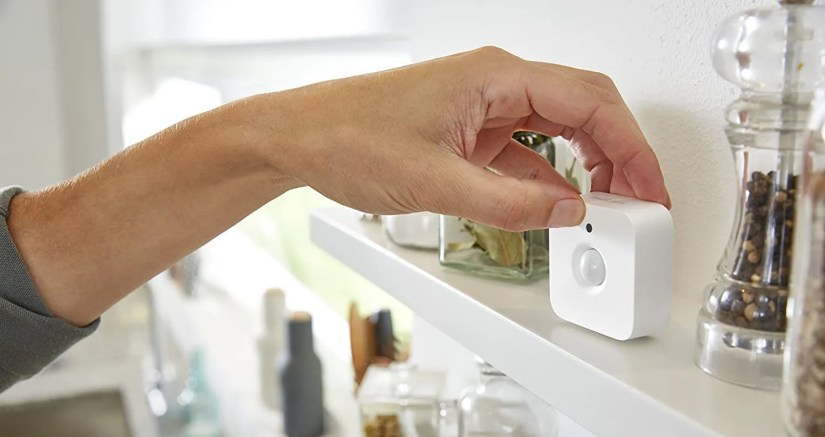 A Philips Hue motion sensor which can switch lights on when needed and off when there&rsquo;s nobody in the room.