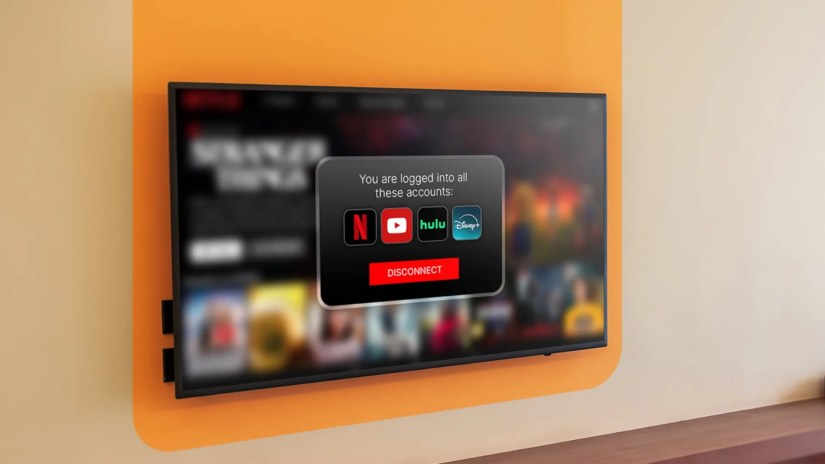 A wall-mounted TV displaying a popup with connected streaming services and a &lsquo;Disconnect&rsquo; button