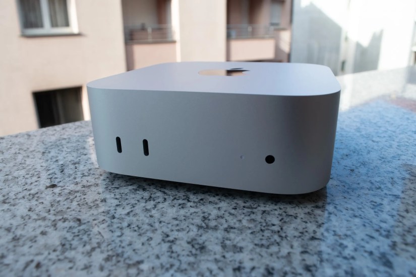 The front side of an M4 Mac Mini with front-mounted ports in the foreground.