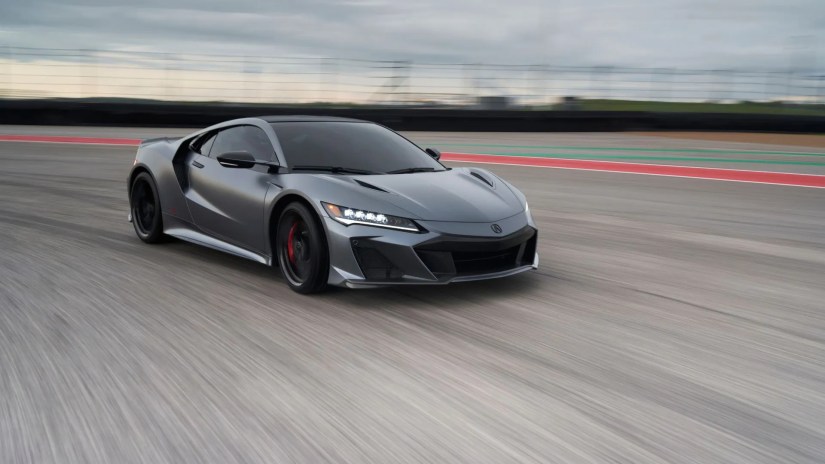 Front 3/4 view of a gray 2022 Acura NSX Type S on track.