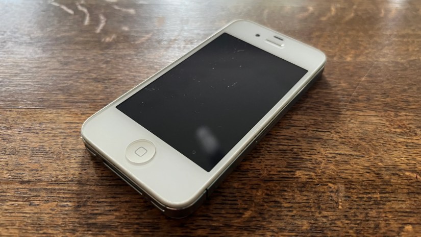 An iPhone 4S in white.