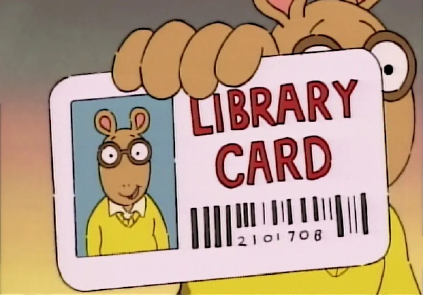 Arthur holding a library card