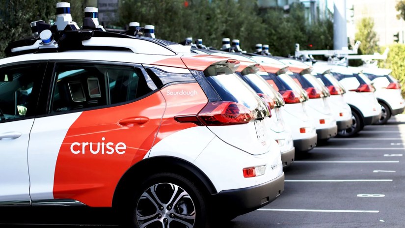 Cruise&rsquo;s car fleet parked side by side in a parking lot.