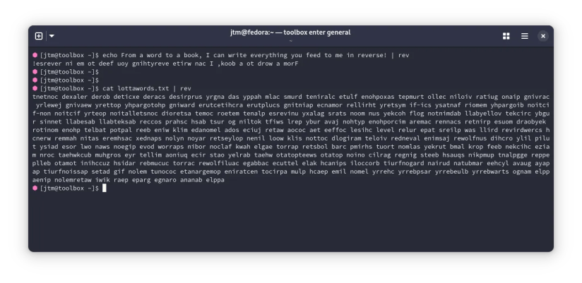Output from the rev command running on a text file in a Linux terminal