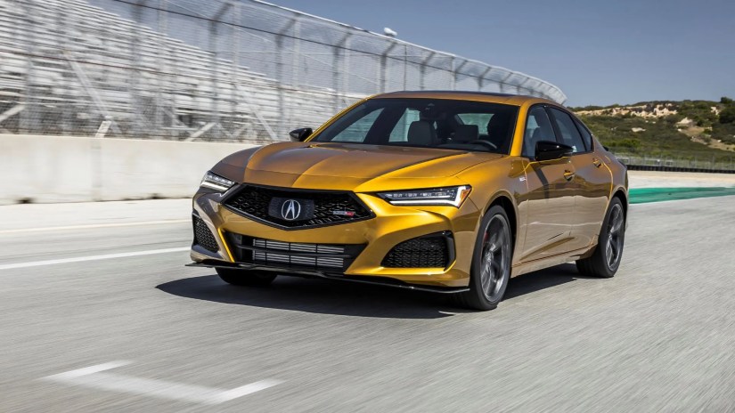 Front 3/4 view of a 2023 Acura TLX Type S on a racetrack.