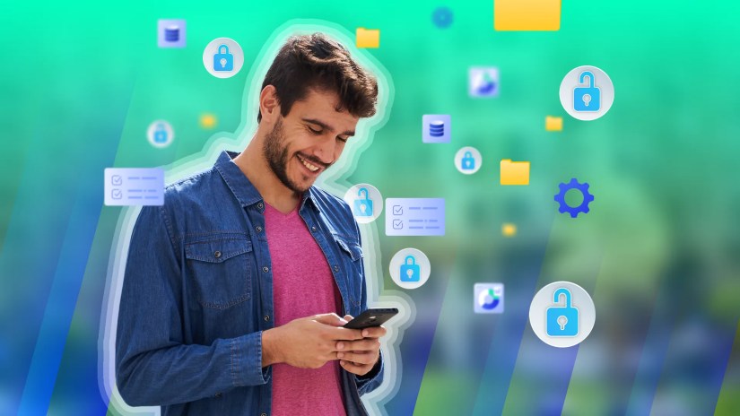 A man using his phone with various file and data icons around him.