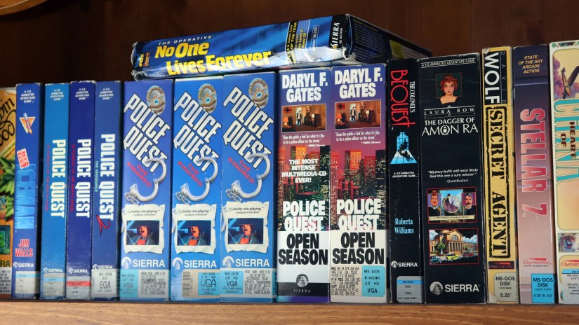 Big box PC games on a shelf.