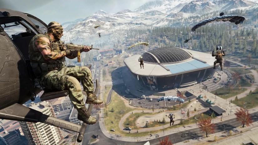 Call of Duty Warzone player on a helicopter looking at parachuting players.