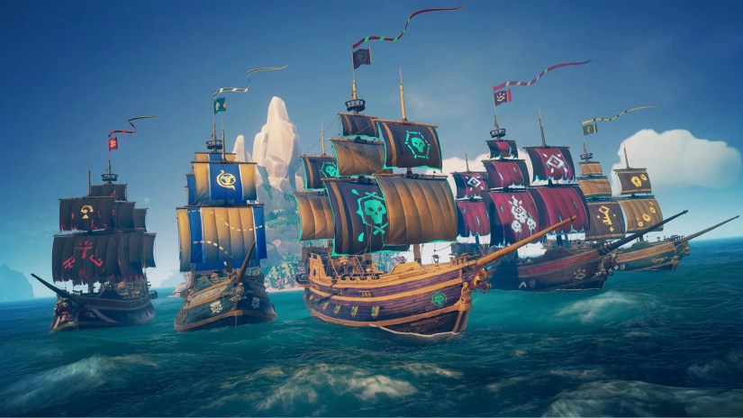 A bunch of ships in Sea of Thieves sailing away from island.