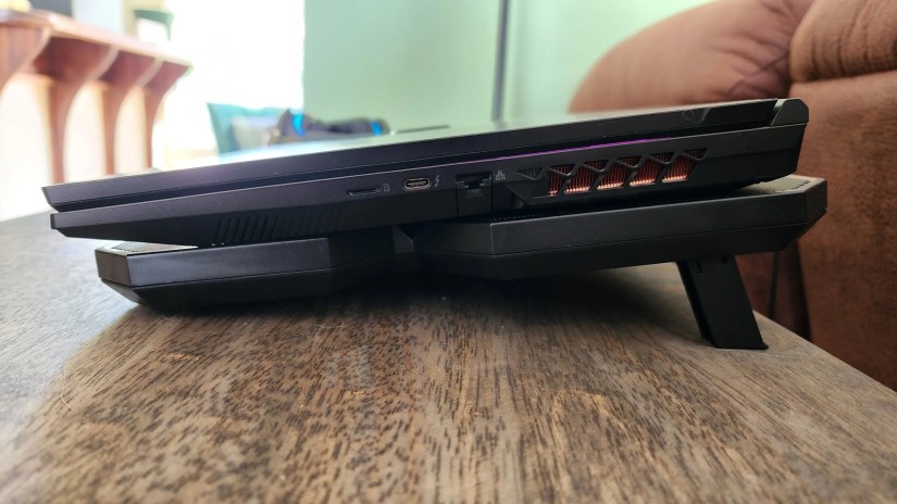 A laptop on a cooling pad seen from the side.