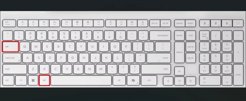 White keyboard with red boxes highlighting the Alt and Tab keys.