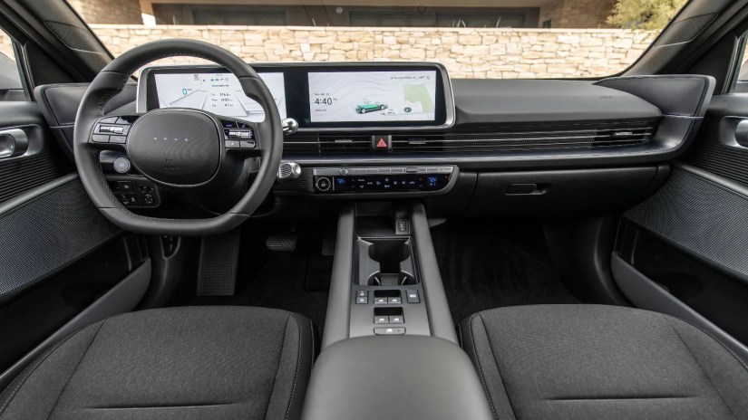 Close-up shot of the dashboard of the 2025 Hyundai Ioniq 6 SE showing the steering wheel and infotainment display.