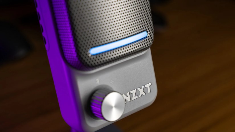A side shot of the NZXT Capsule Elite microphone showing the gain knob, light bar, and logo.