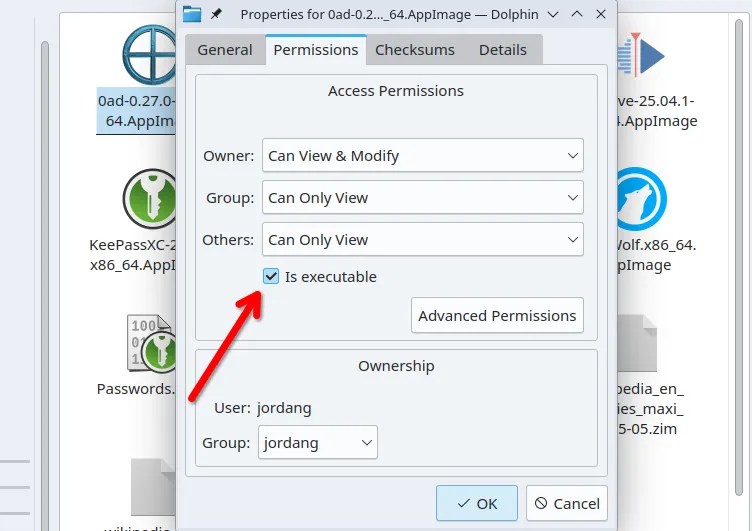 The Dolphin browser permission management dialog, with a red arrow pointing to the ‘Is executable’ checkbox.