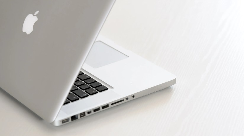 An old-style pre-Retina MacBook Pro with an optical drive.