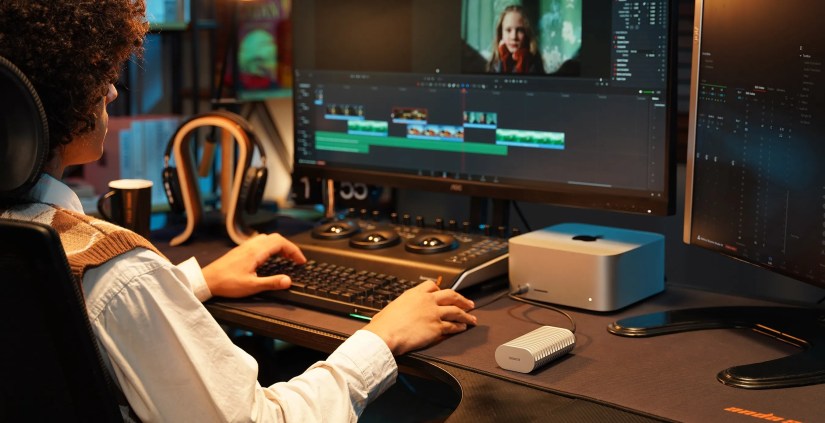 The Terramaster D1 SSD plugged into a Mac Mini with the user editing a video.