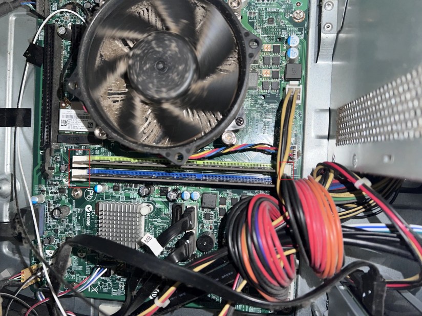 An internal view of a desktop PC, with components in view.