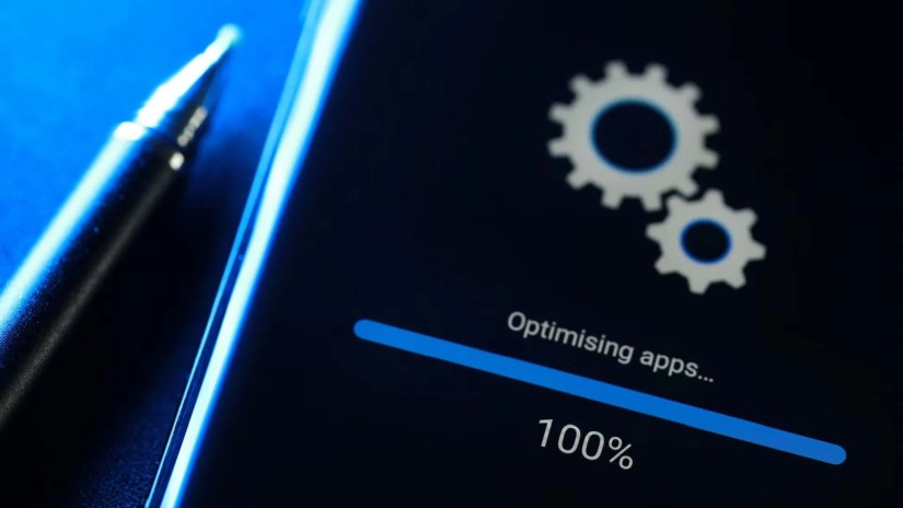 Soft focus image Android phone installing system update in progress.