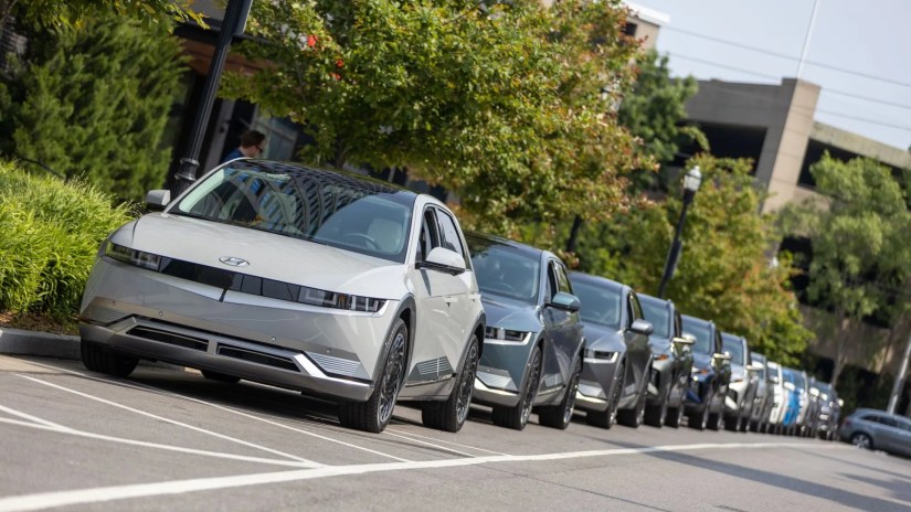 Shot showing a line of Hyundai Ioniq 5 cars parked parked at the side of the road.