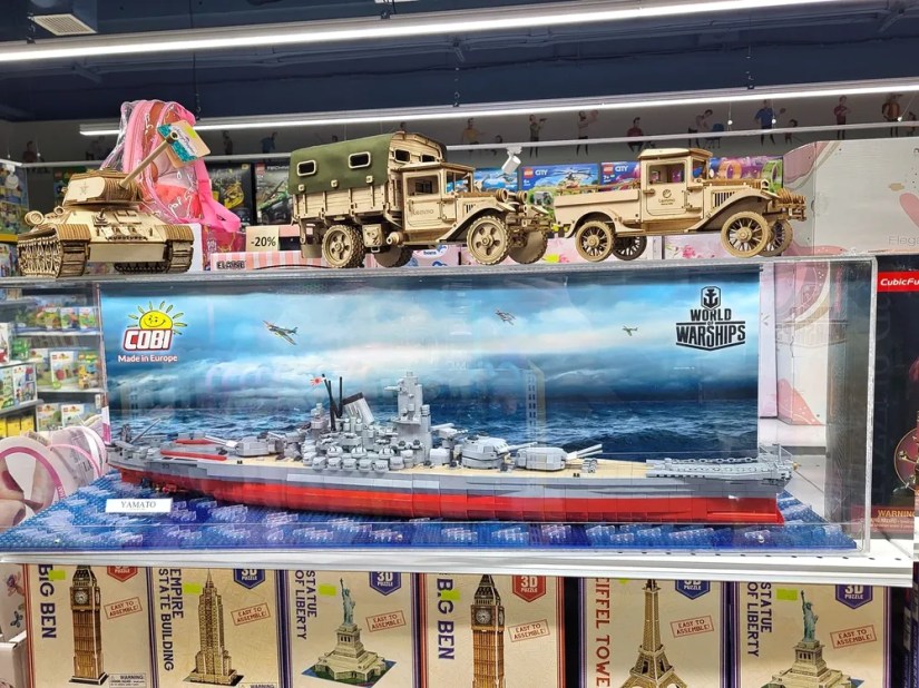 A large Cobi warship model in a display case.