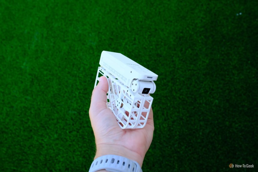 HoverAir X1 folded and being held in a hand